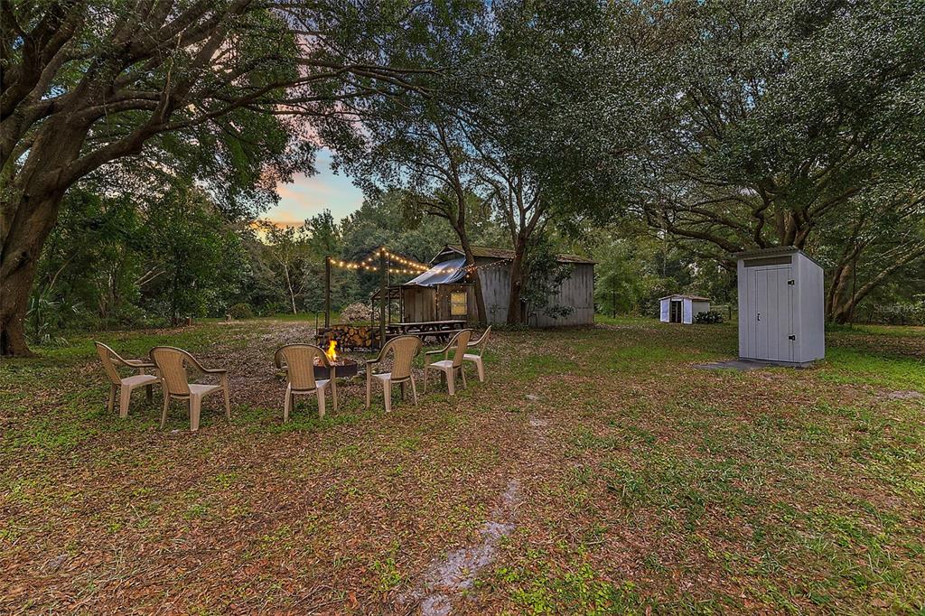 a view of a yard with table and chairs