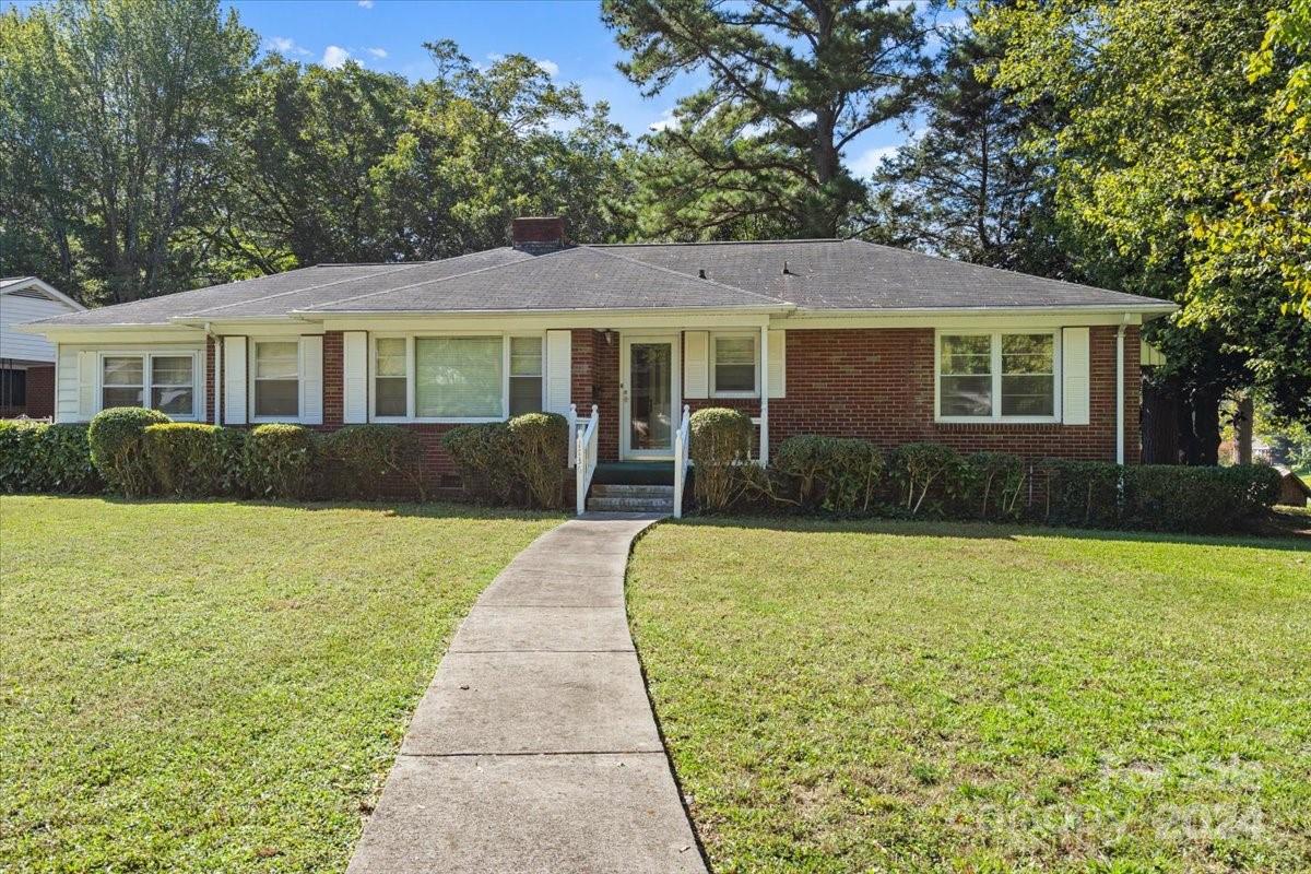 a front view of a house with yard