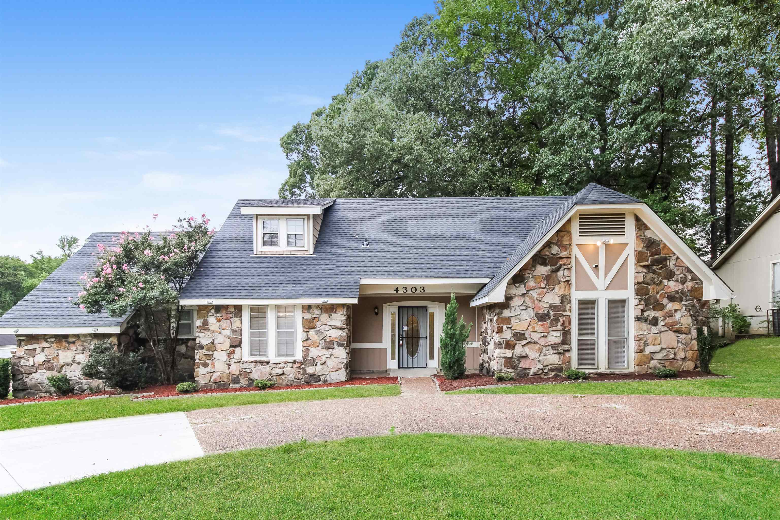 front view of a house with a yard