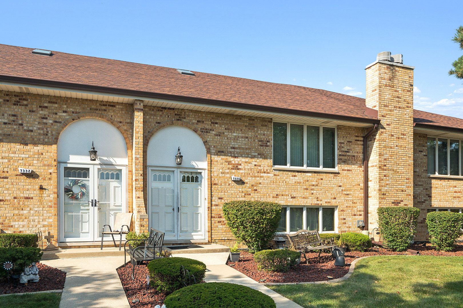 a front view of a house with garden