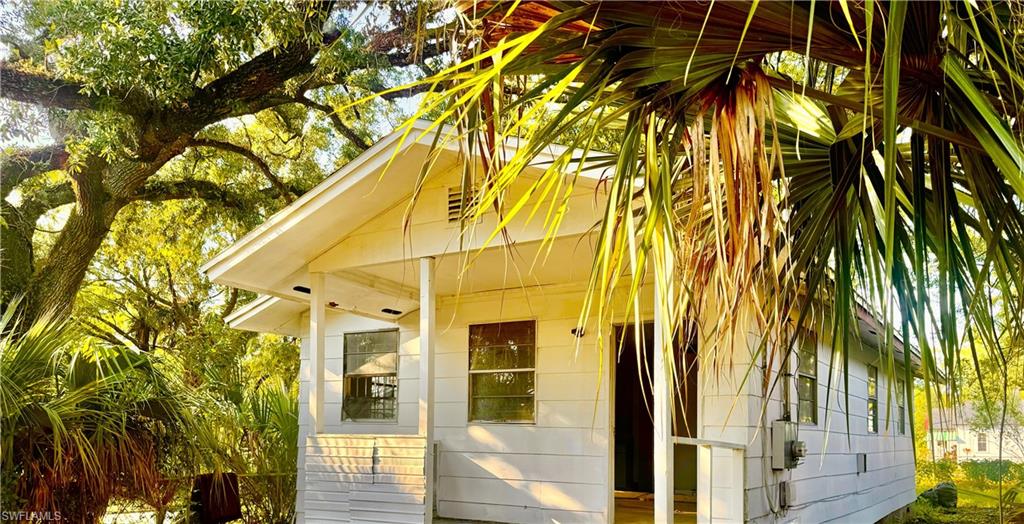 a view of a house with a tree