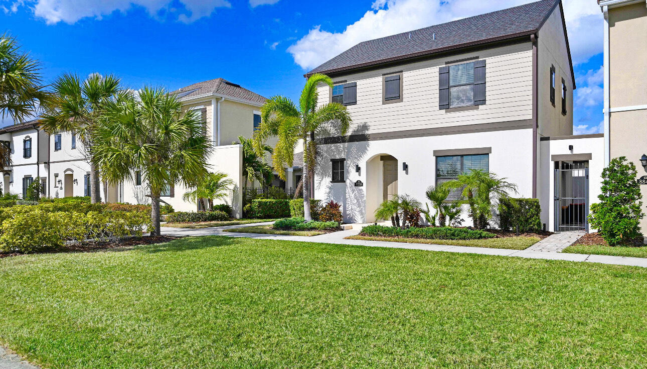 a front view of a house with a yard