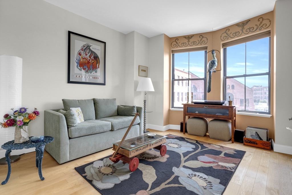 a living room with furniture and a window