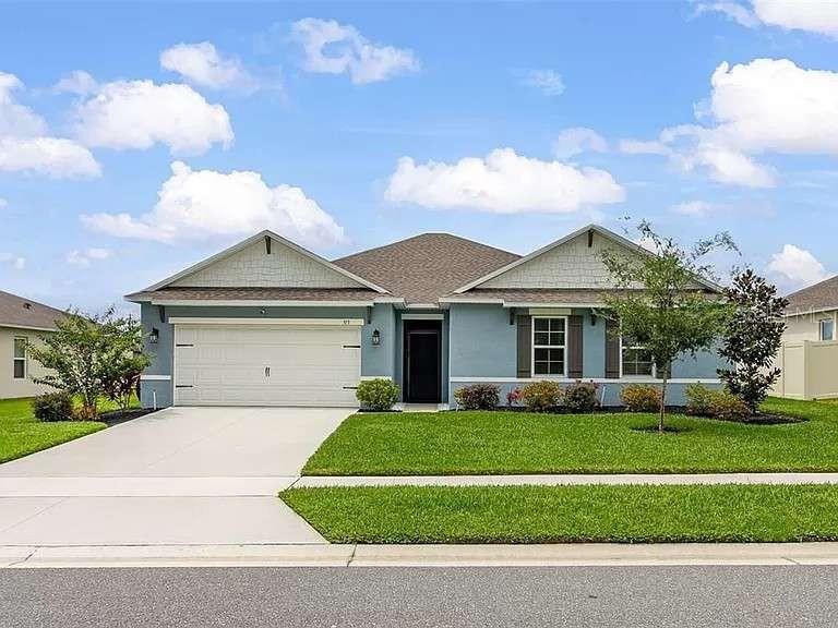 front view of a house with a yard