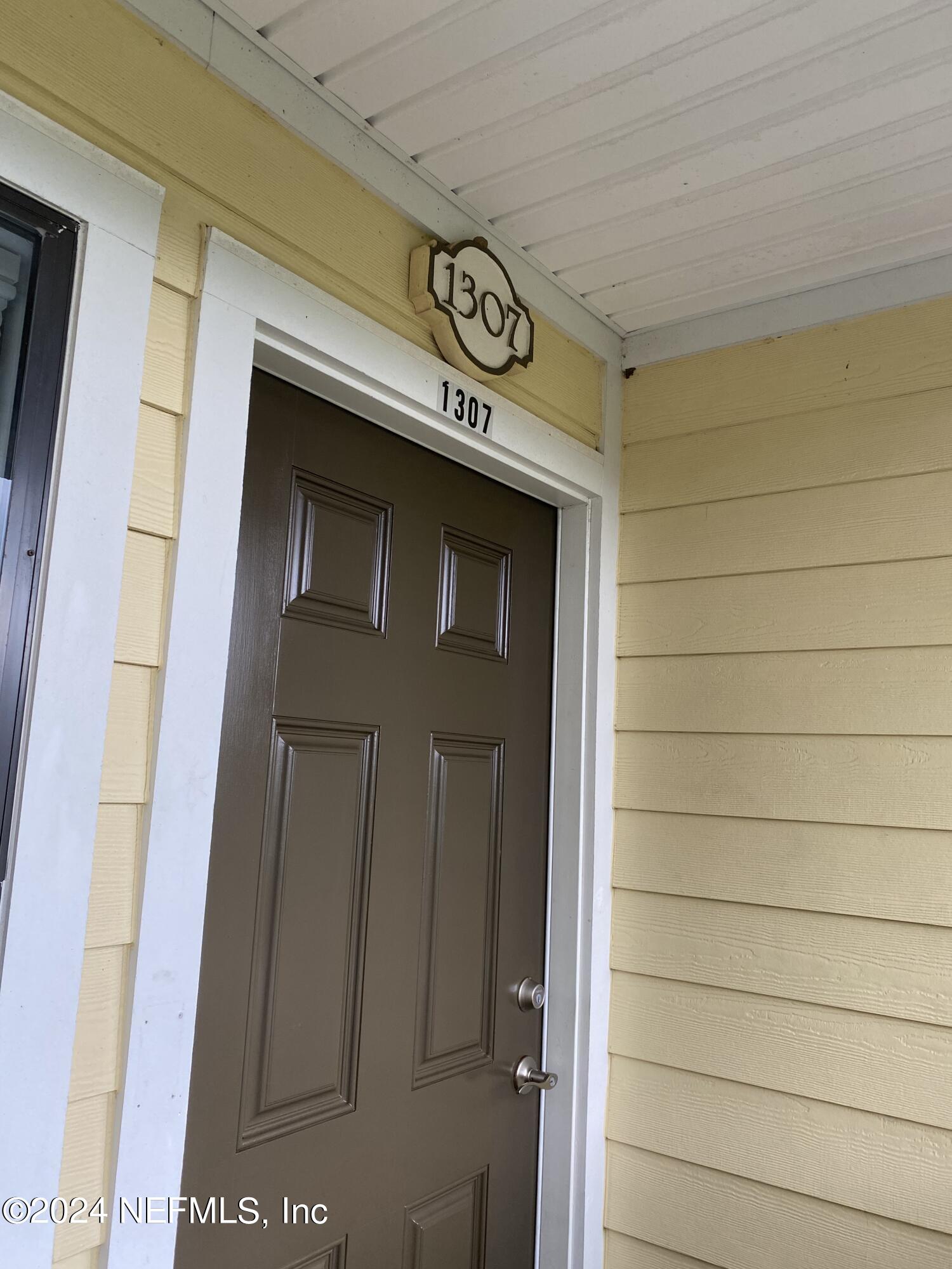 a view of a door and a window