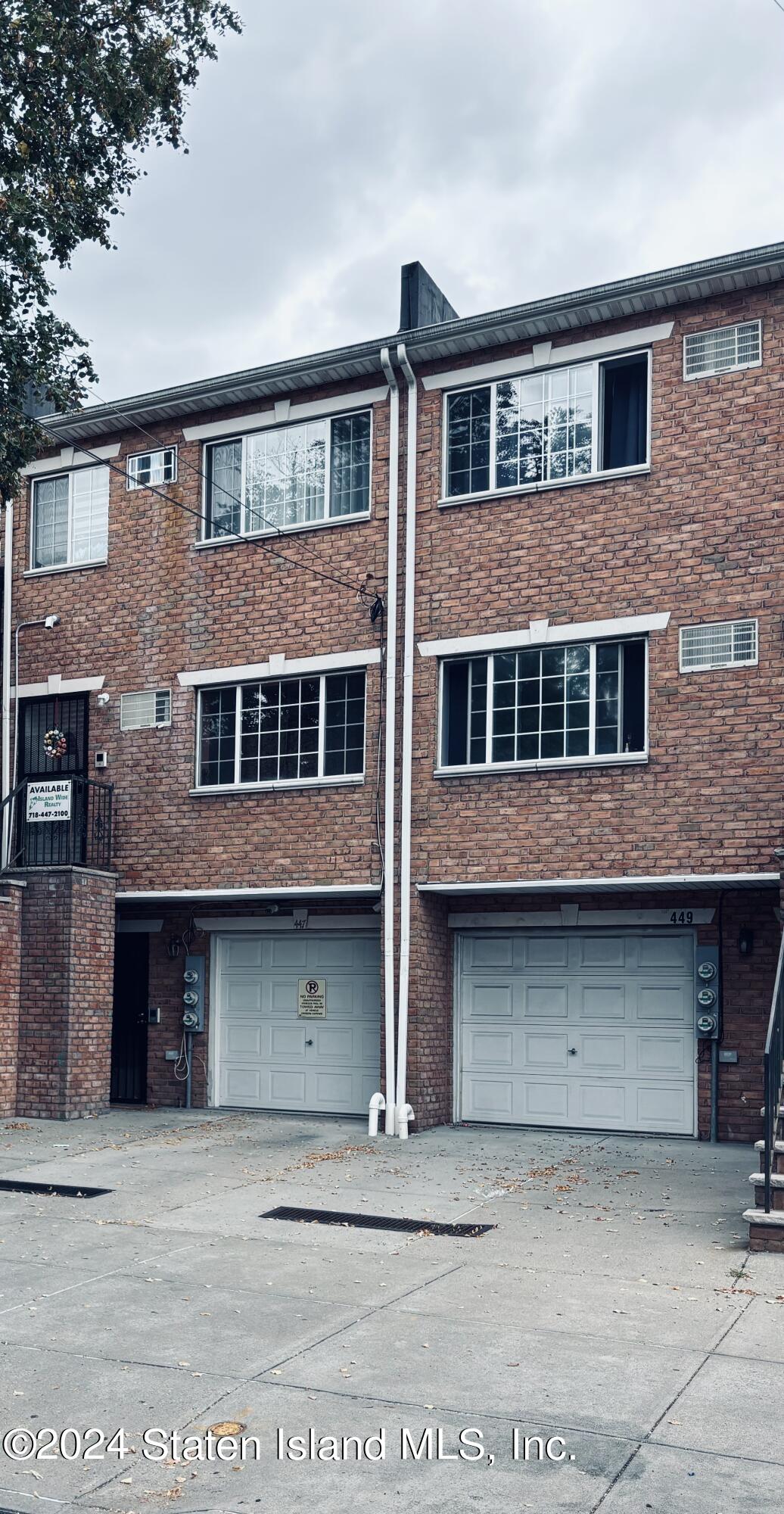 a front view of a house with a garage