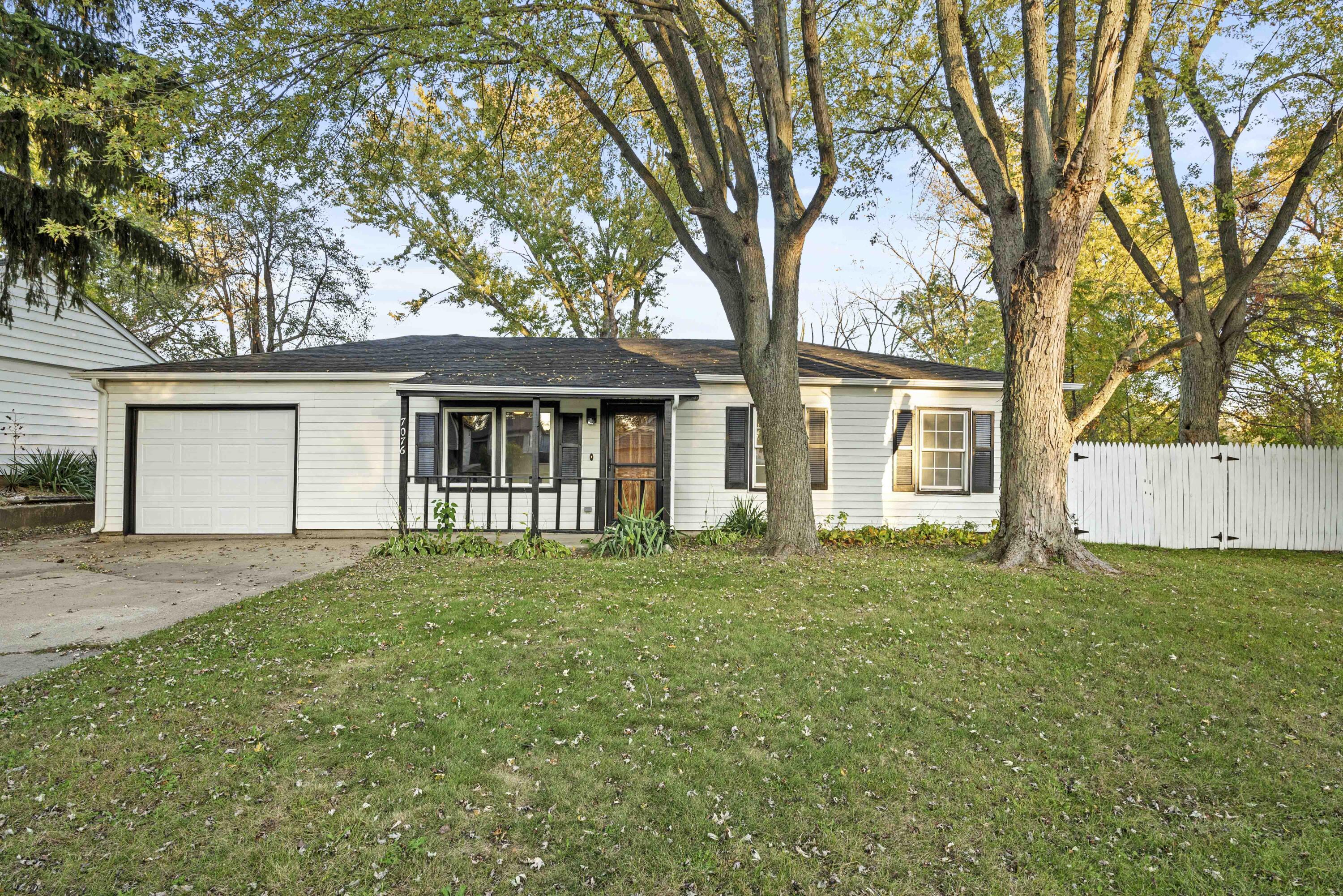 front view of a house with a garden