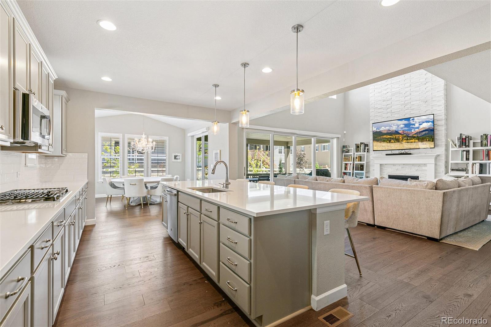 a kitchen with stainless steel appliances granite countertop a stove and cabinets