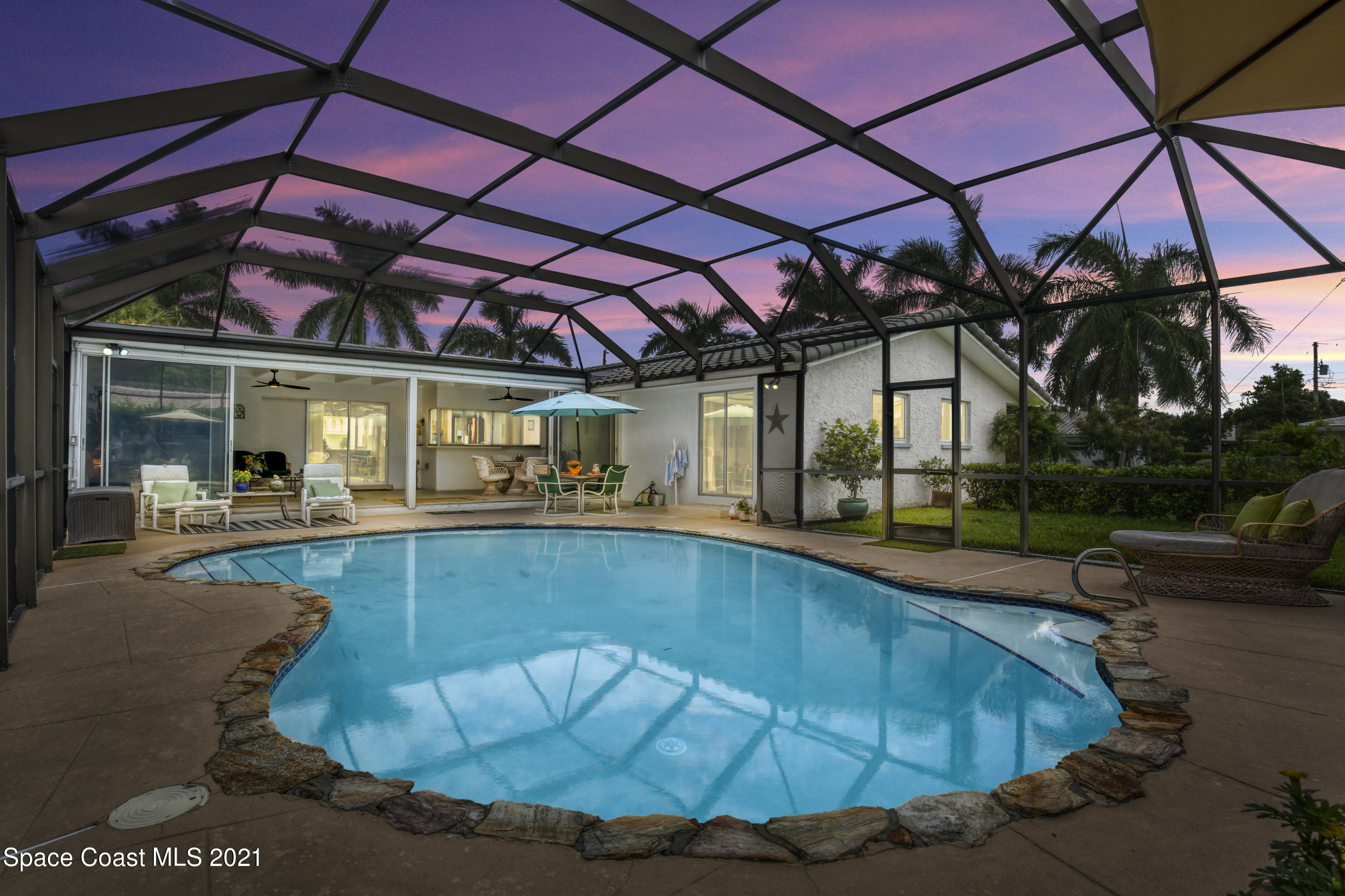 a view of a swimming pool with a patio