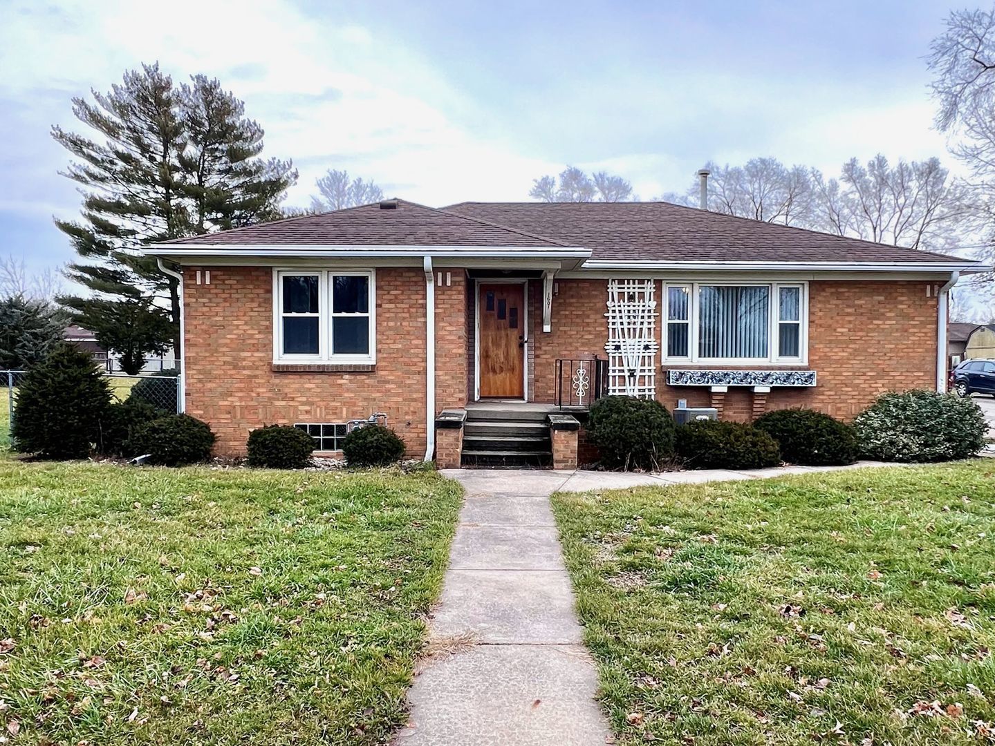 a front view of a house with yard