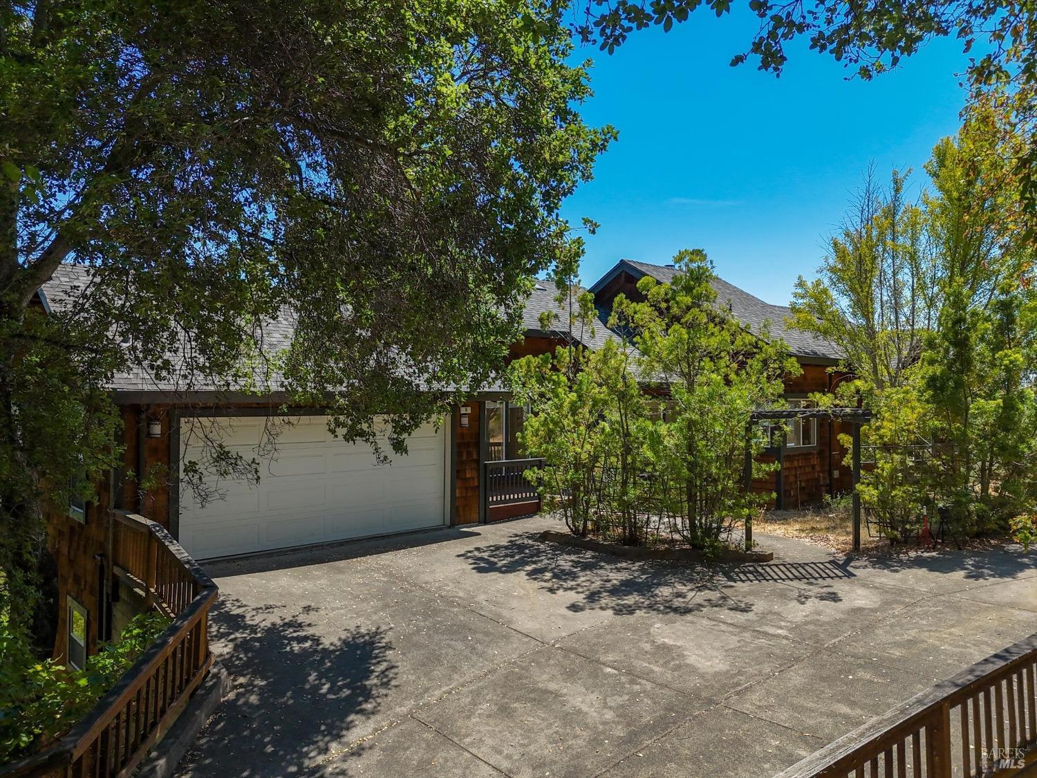 a view of a house with a tree