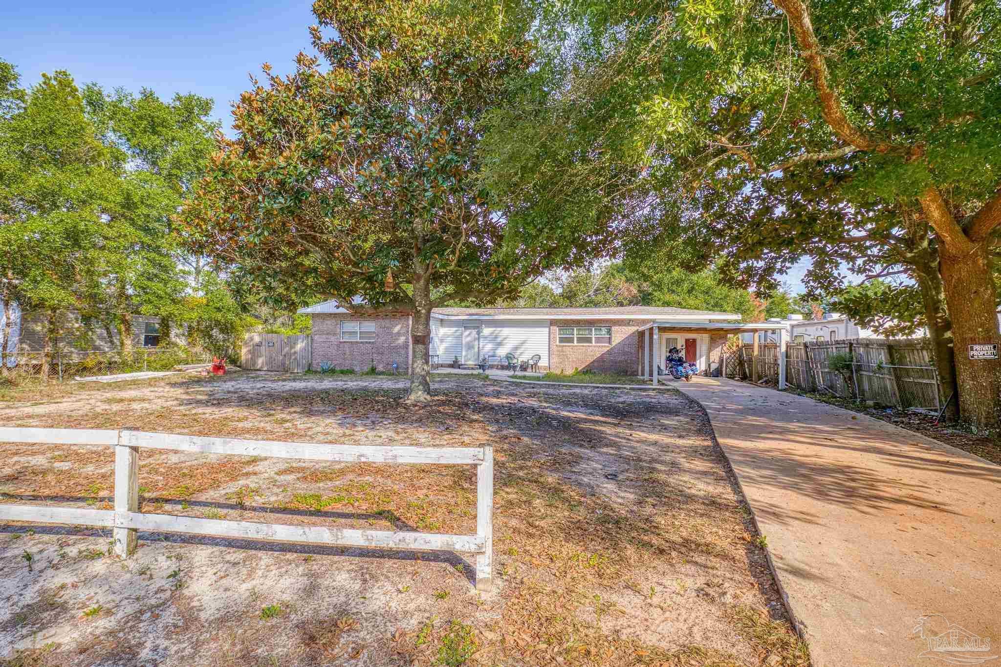 a view of a house with a yard