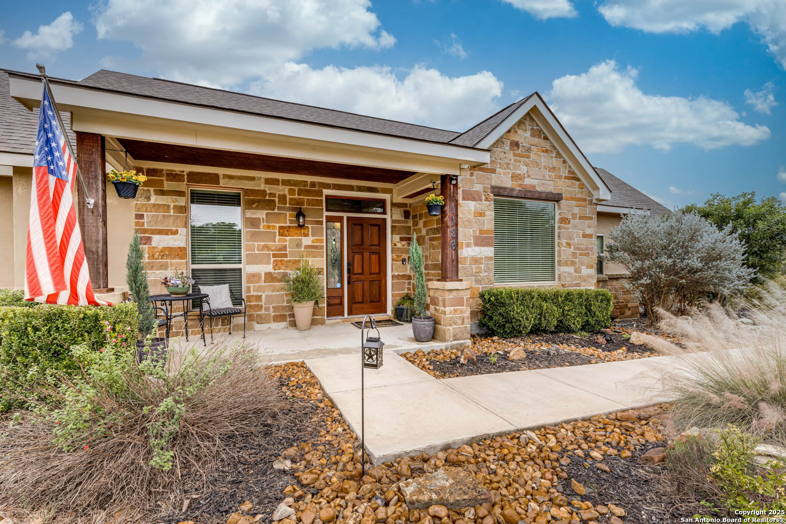 front view of a house with a patio