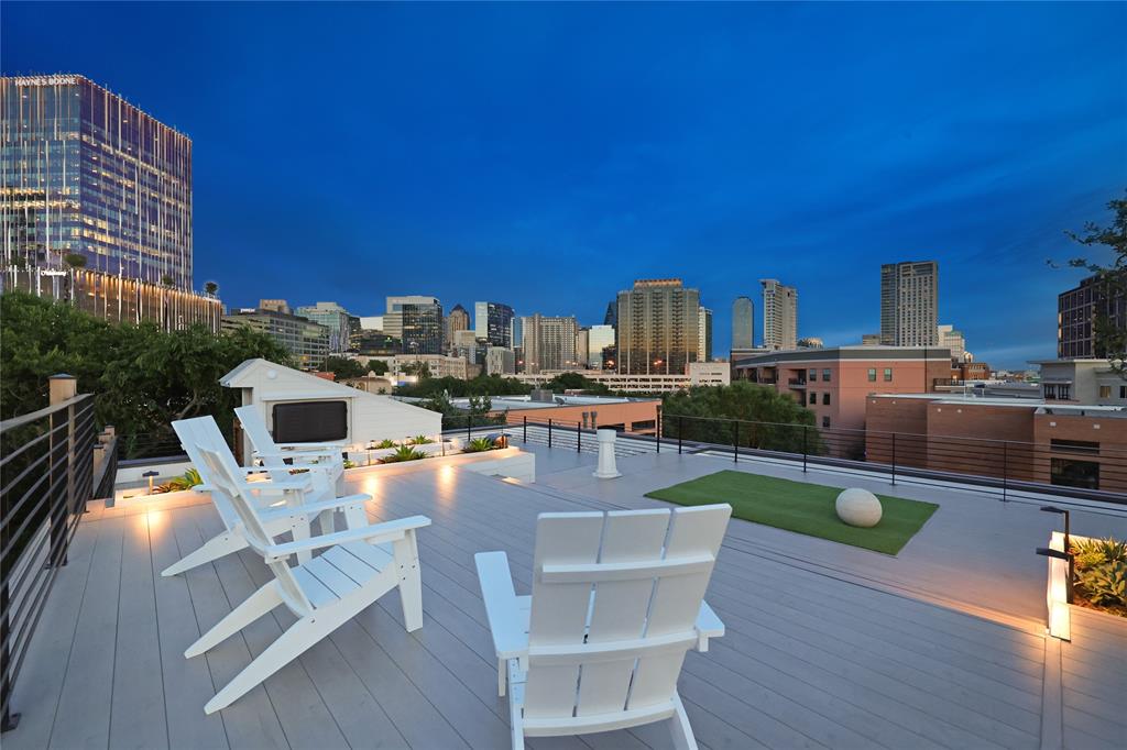 a view of a patio with chairs and table