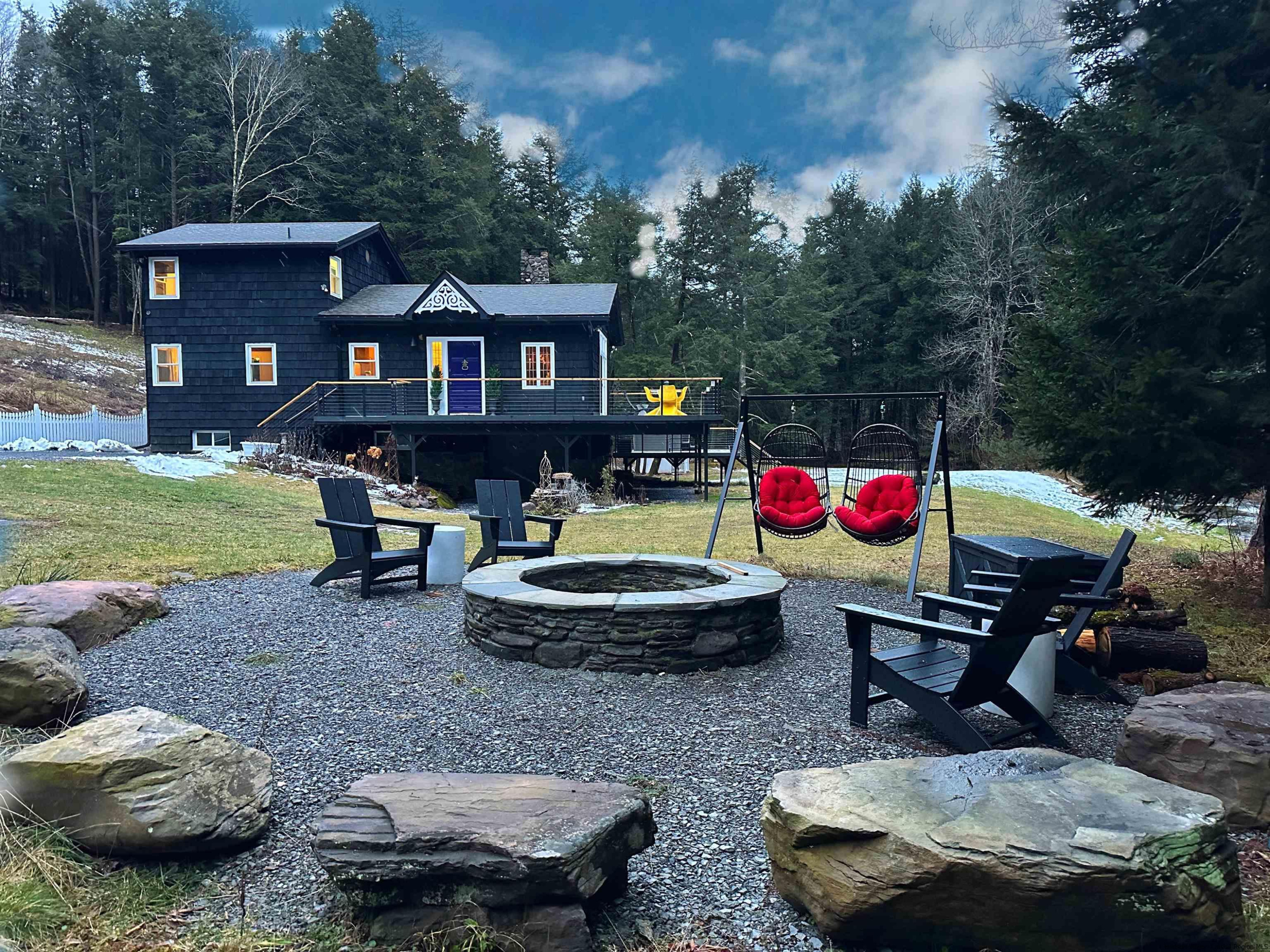 a view of a backyard with sitting area