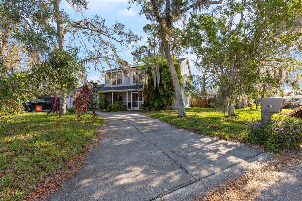 a view of a house with a yard