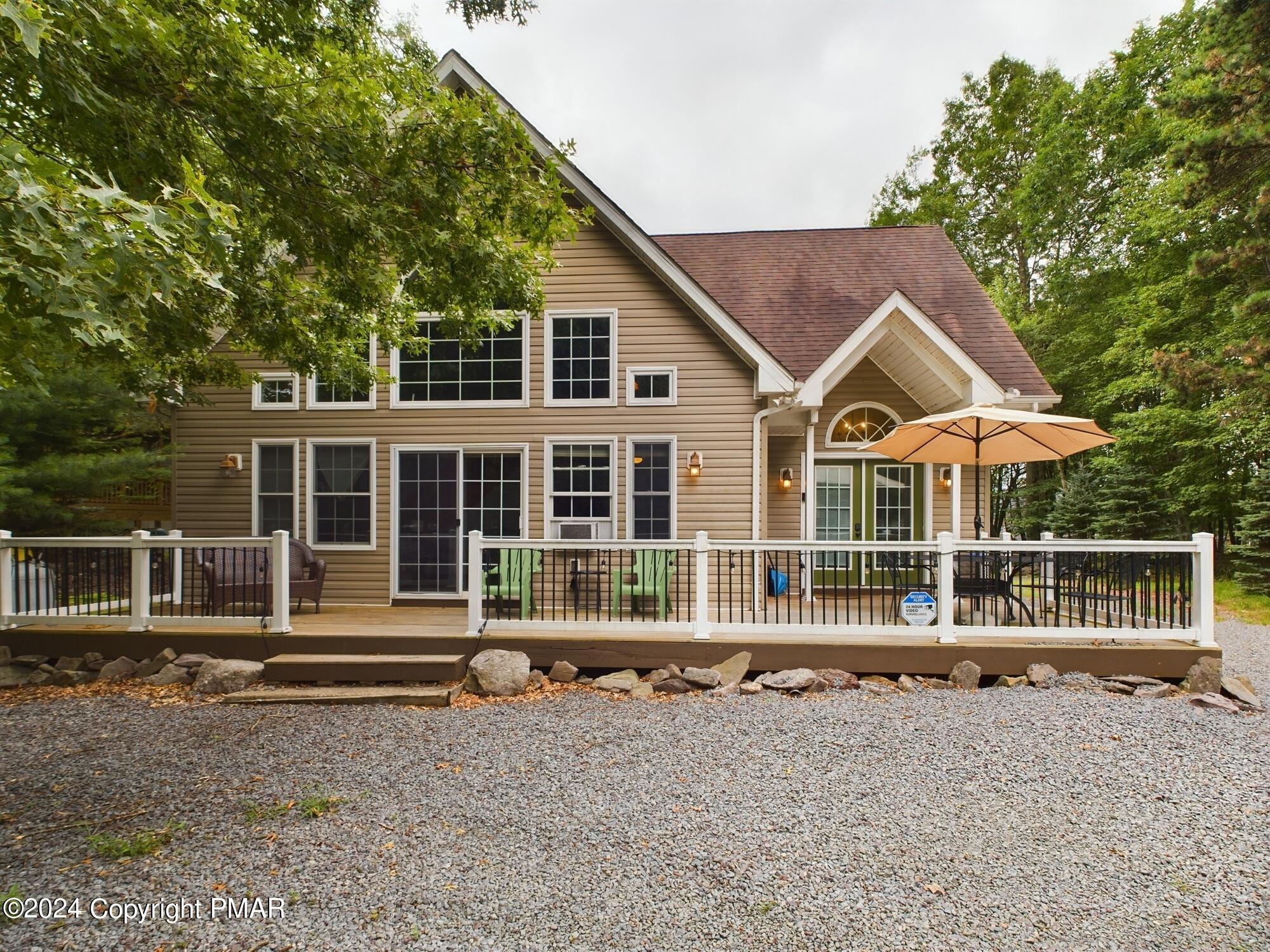 a house with trees in the background