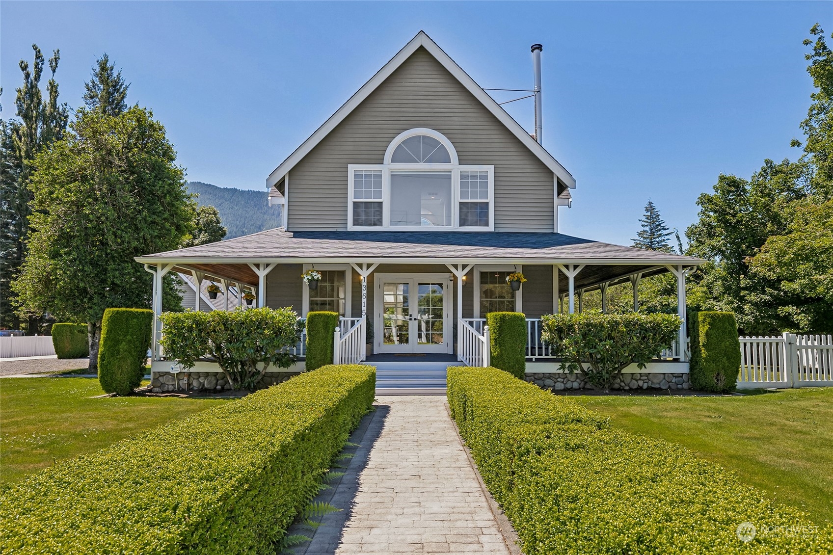 a front view of a house with garden