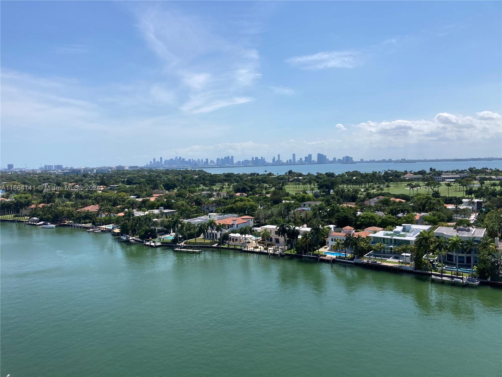 an aerial view of city and lake