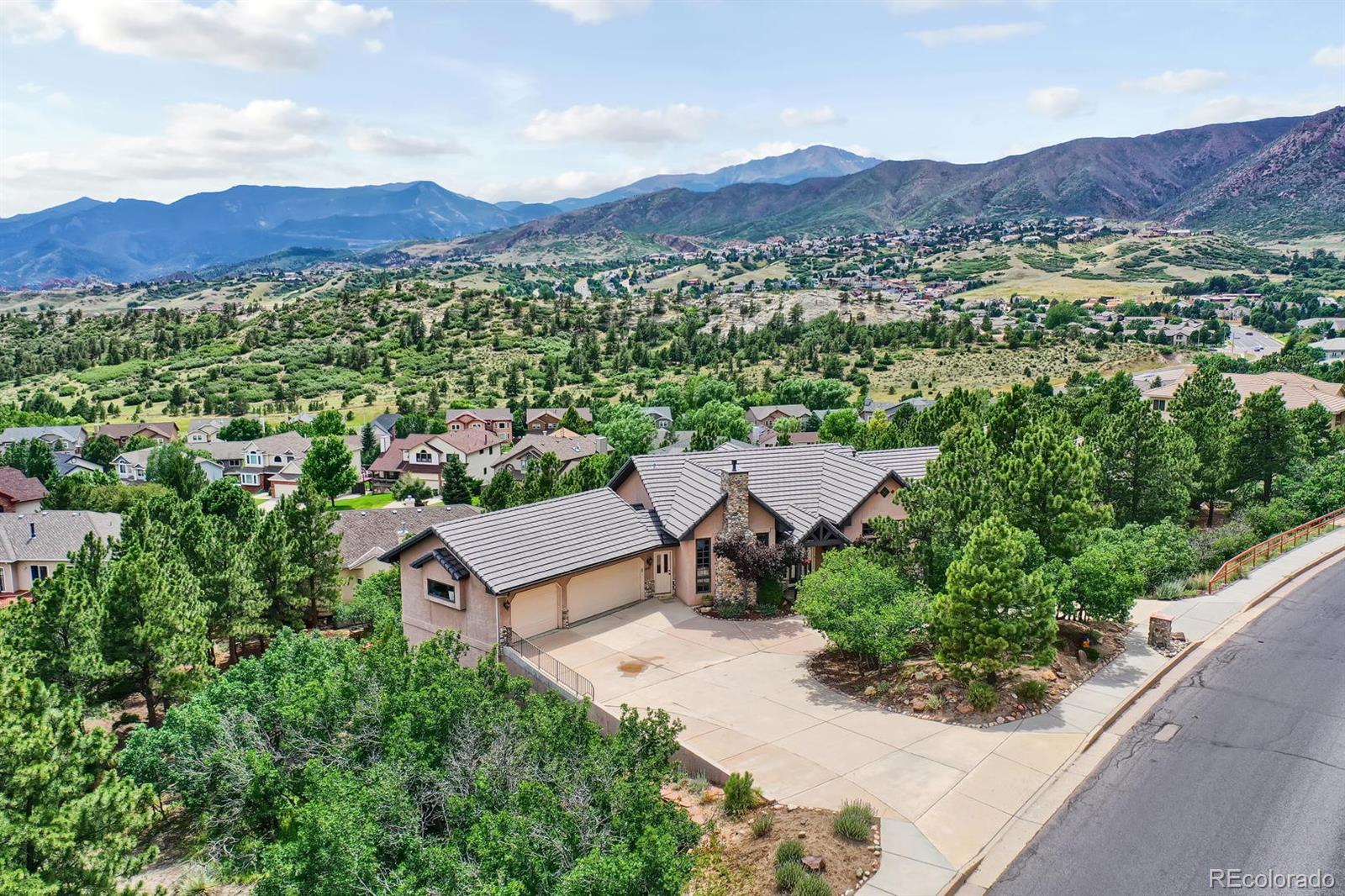 an aerial view of a house with mountain view