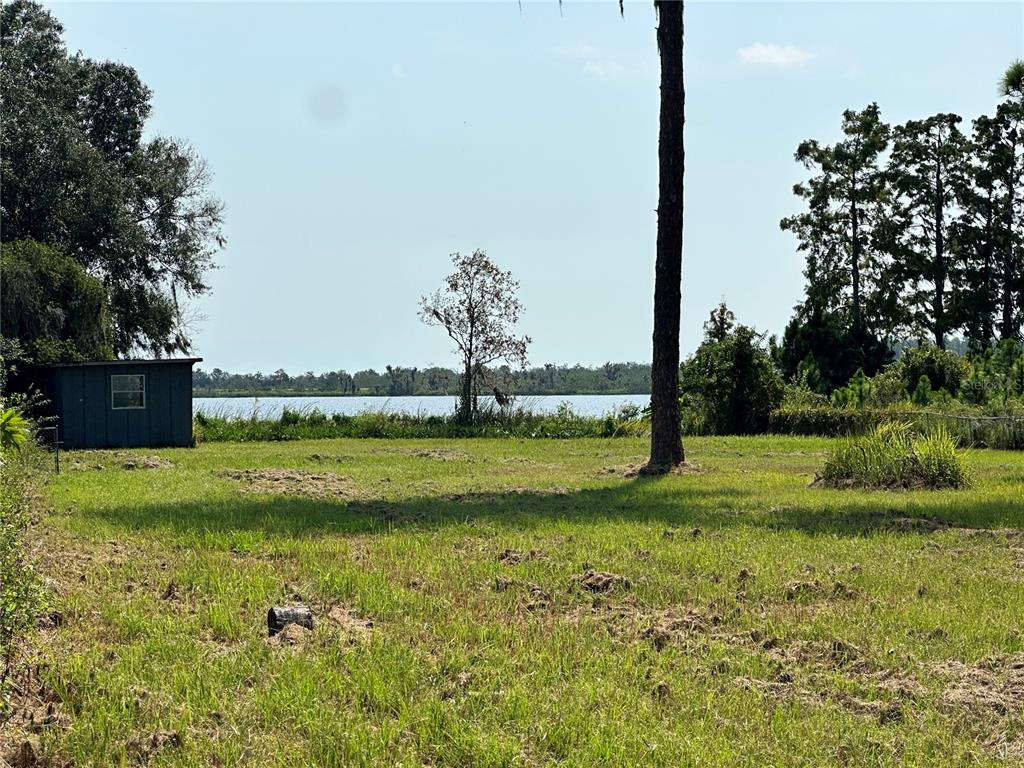 a view of a golf course with a lake view