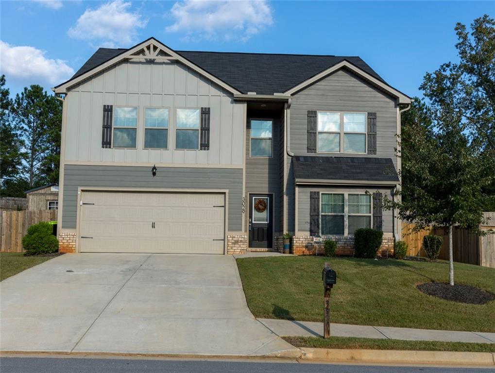 front view of a house with a yard