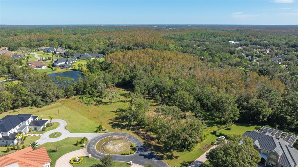 an aerial view of multiple house with yard