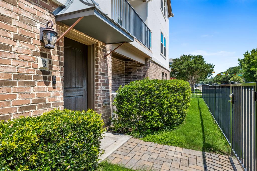 a brick building with a yard