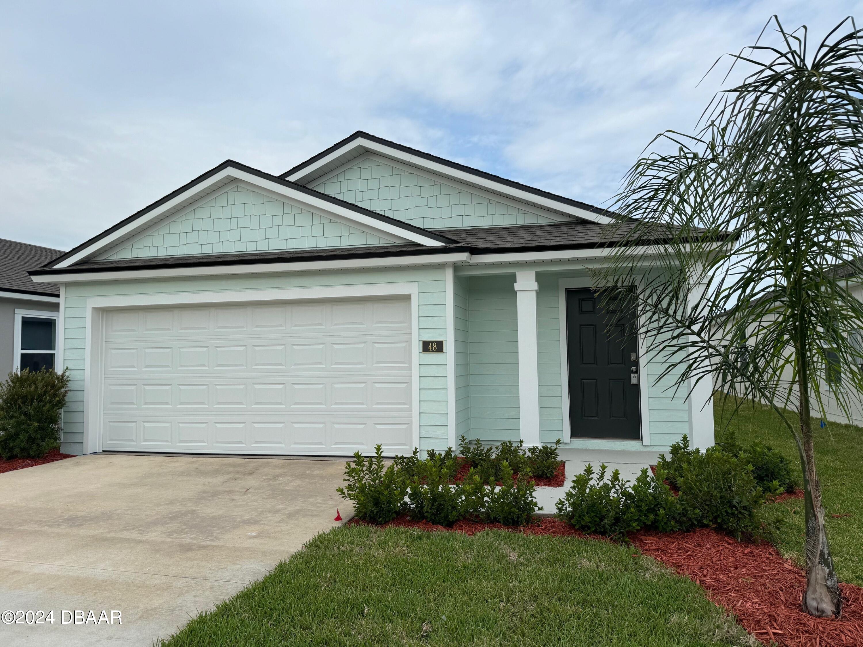 front view of a house with a small yard