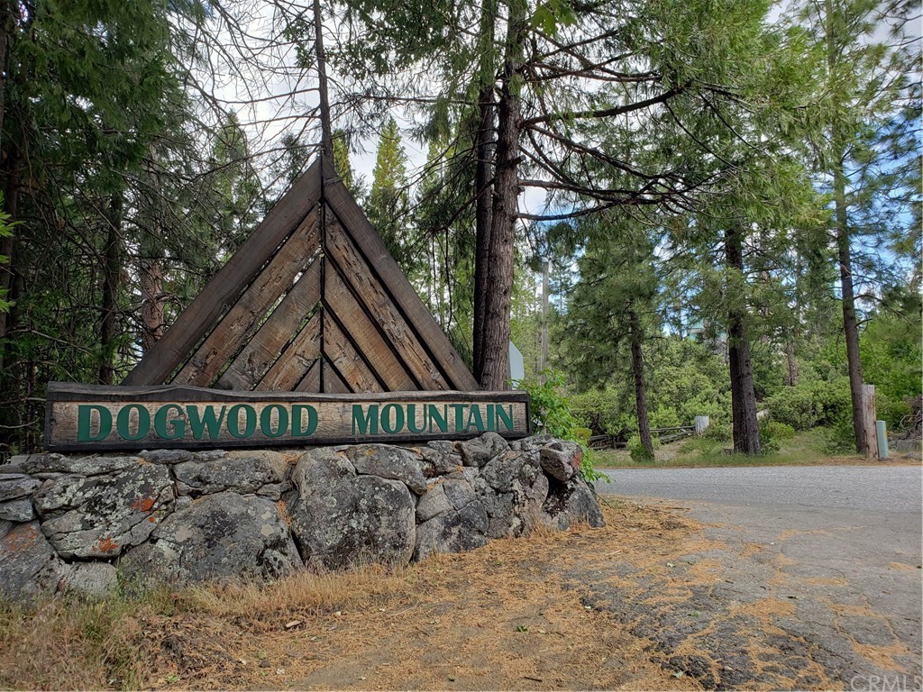 a view of a wooden fence next to a road