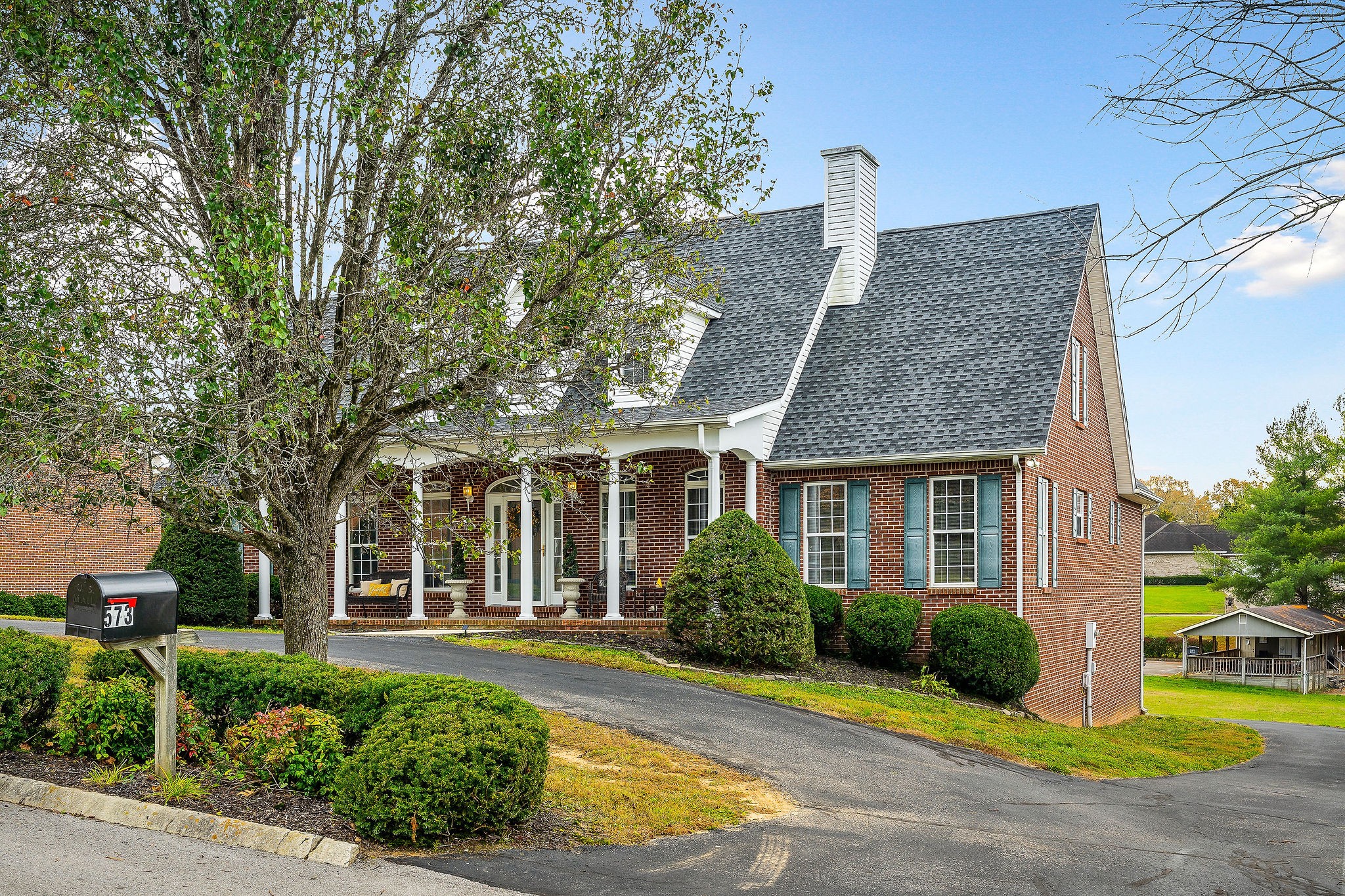 front view of a house with a yard