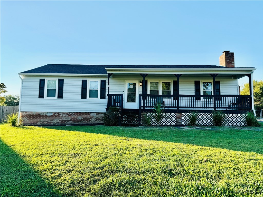 a view of a house with swimming pool and porch with a garden