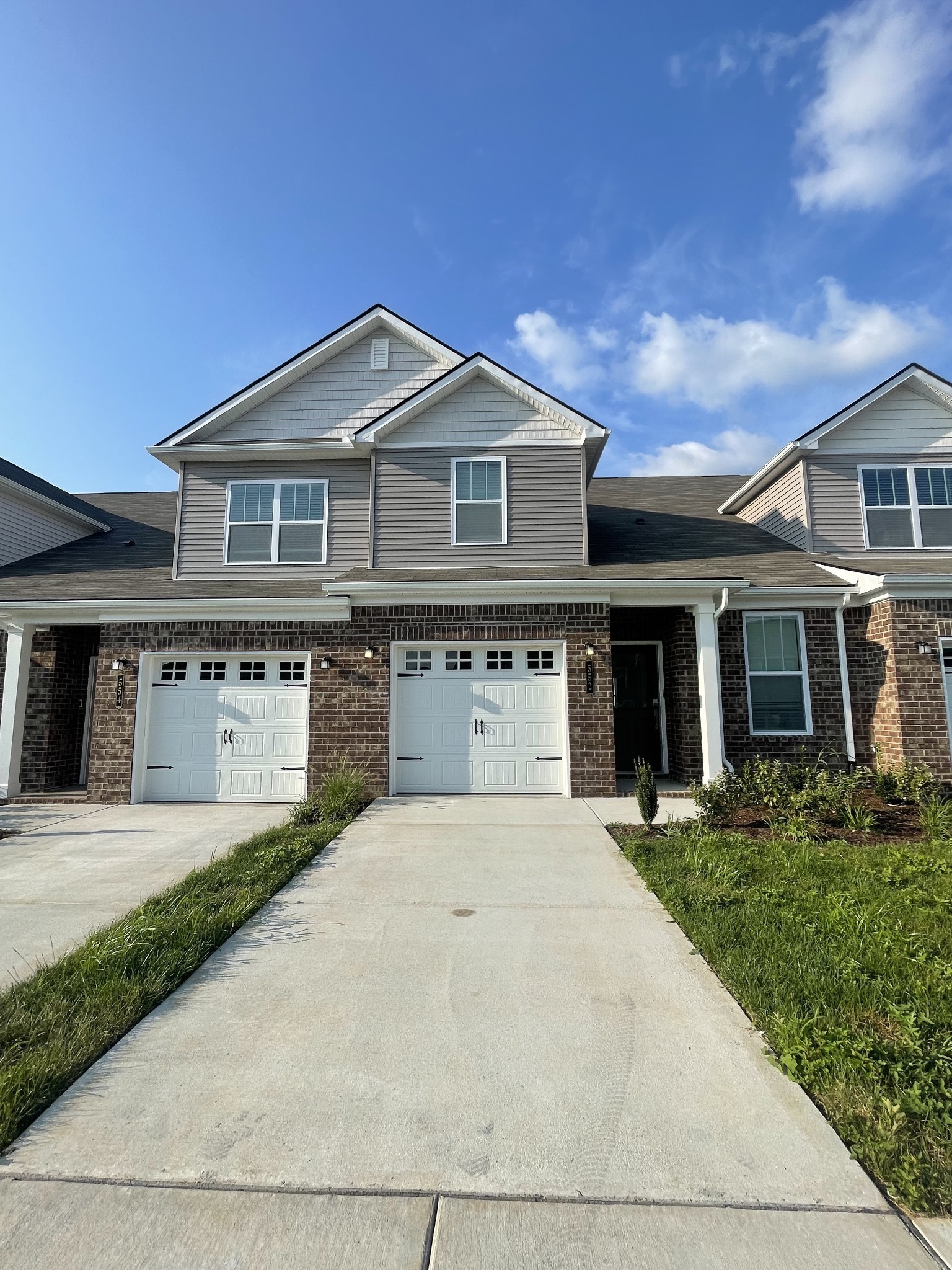 a front view of a house with yard