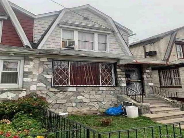 a front view of a house with sitting area