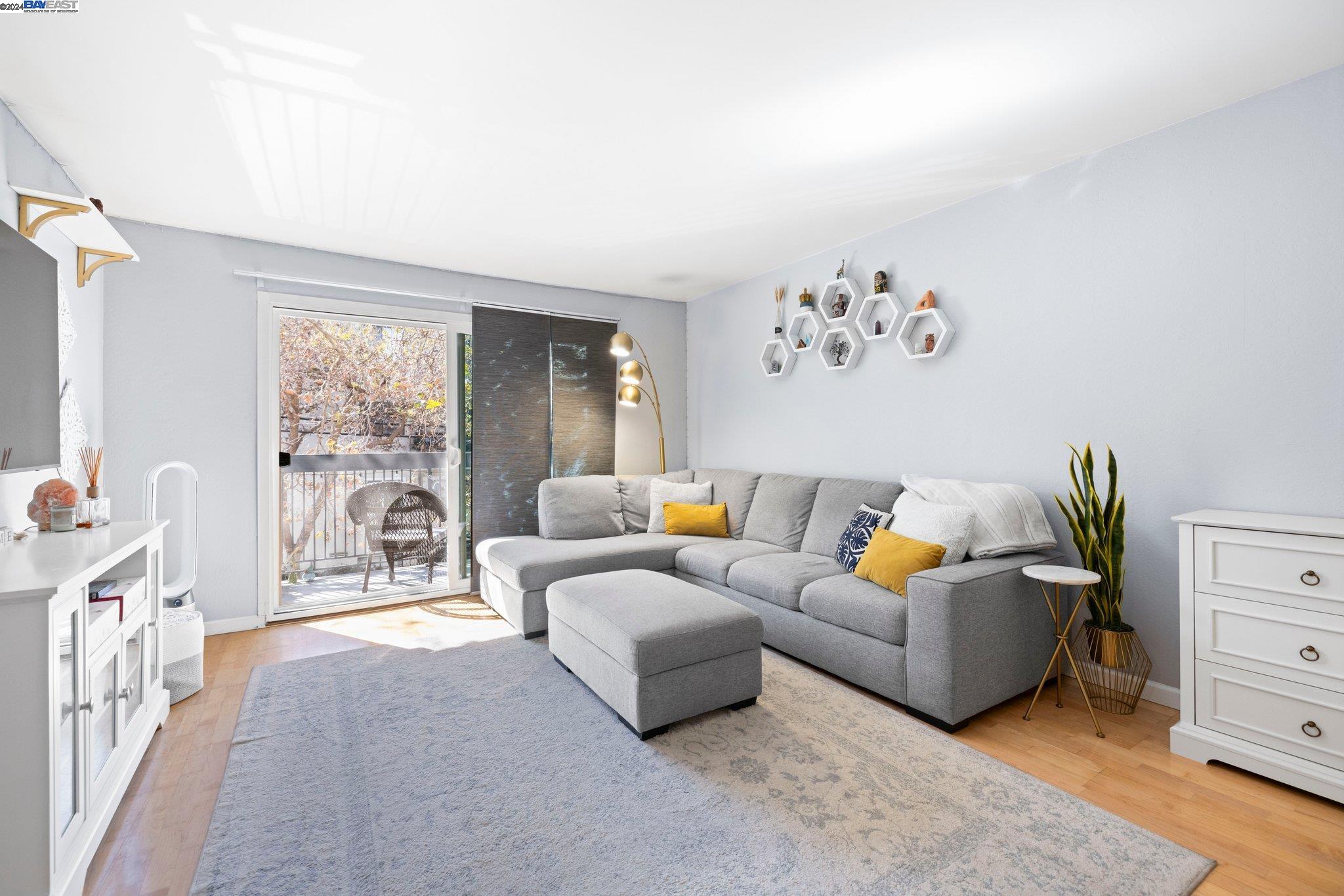 a living room with furniture and a large window