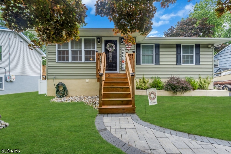 a front view of a house with garden