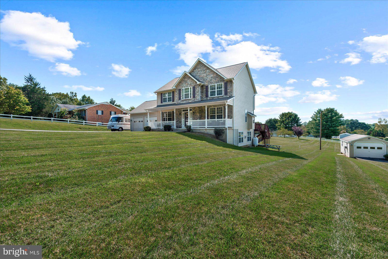 a view of a house with a big yard