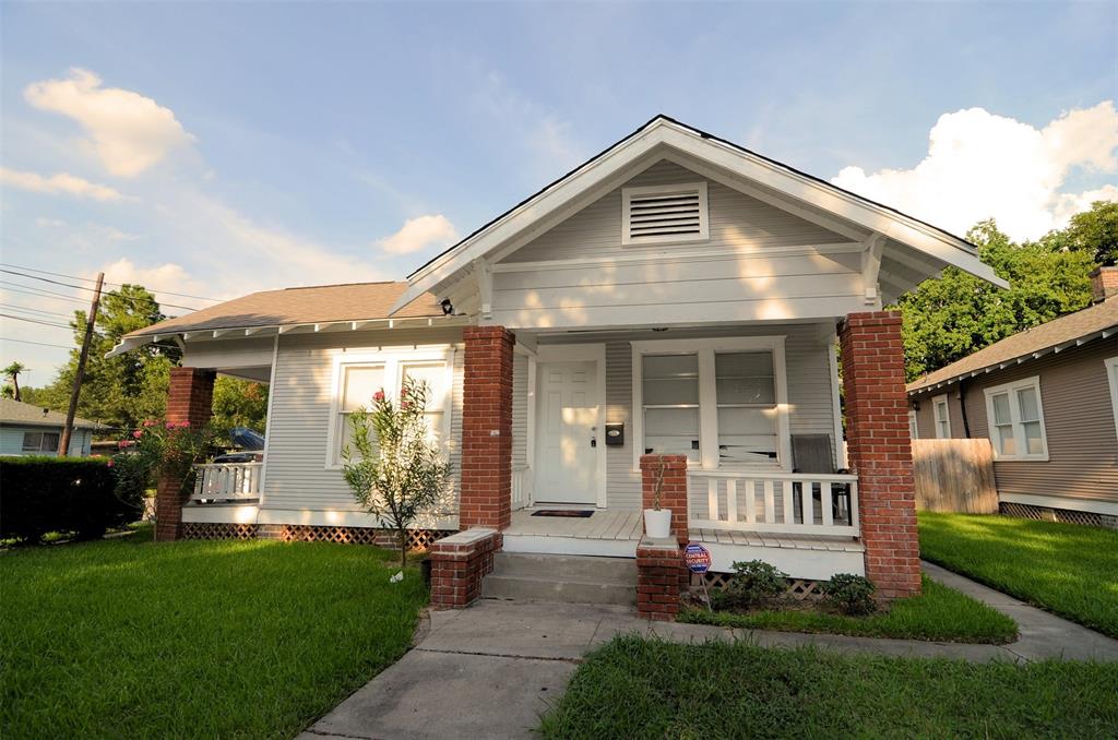 a front view of a house with a yard and porch