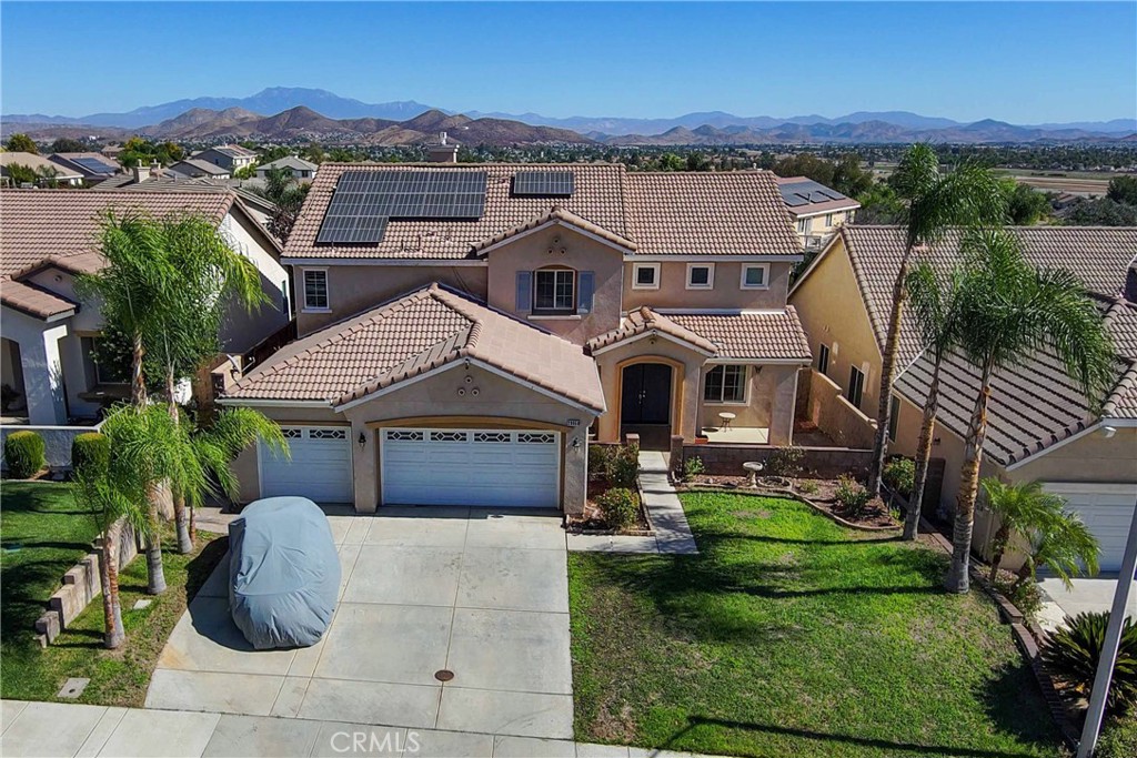 an aerial view of a house with a garden