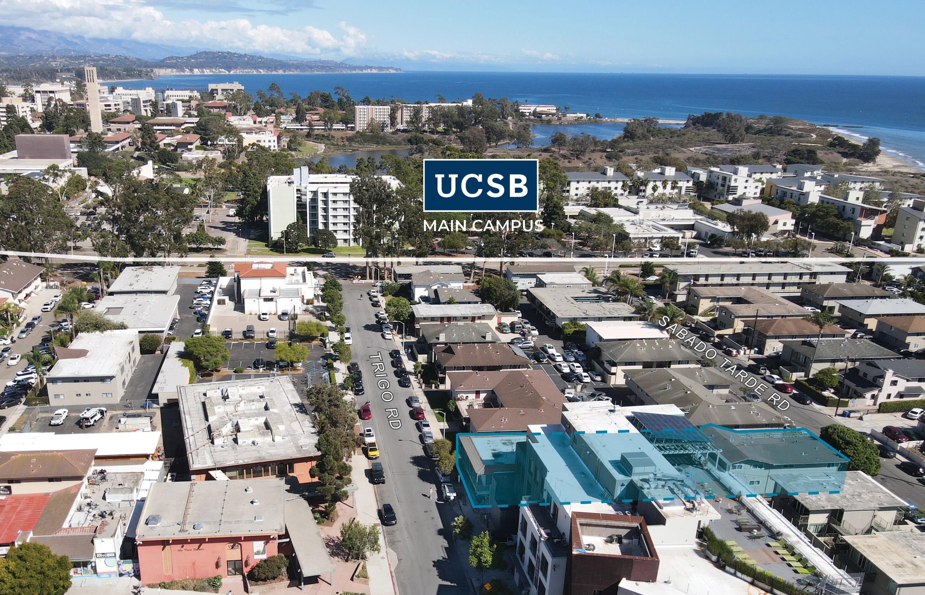 an aerial view of residential building with parking