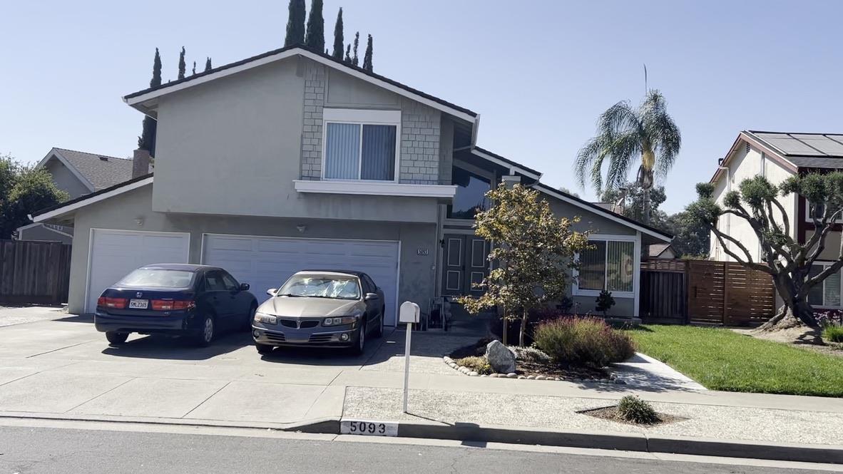 a car parked in front of a house