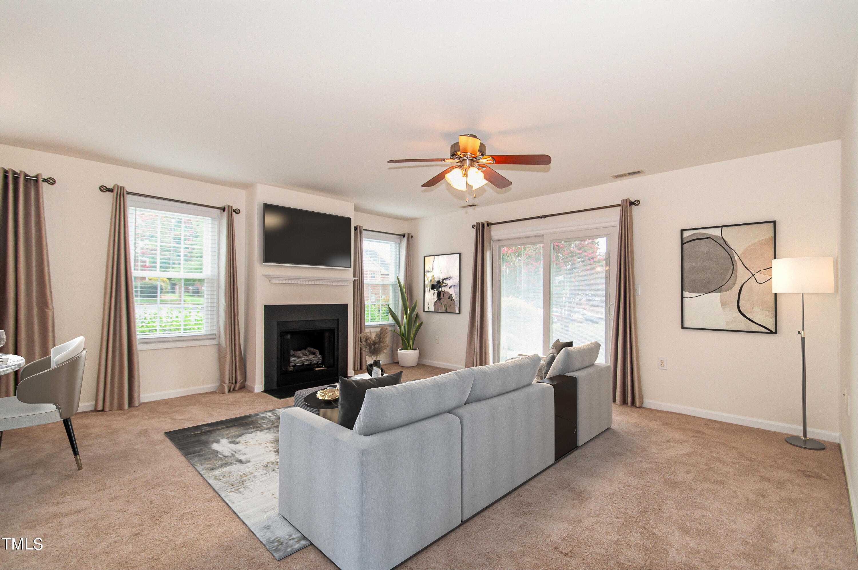 a living room with furniture and a fireplace