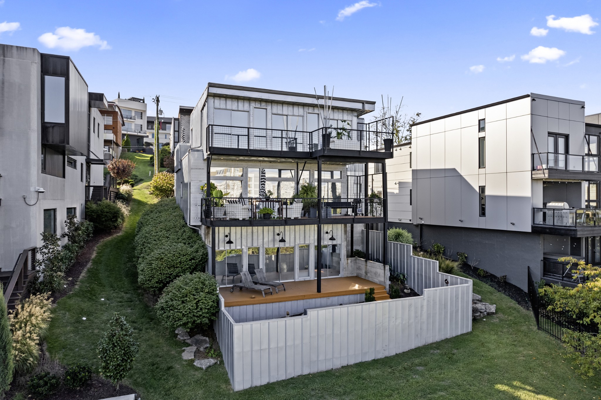 East facing back of home enclosed with steel fencing