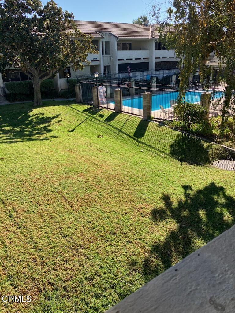 a view of a swimming pool with a bench