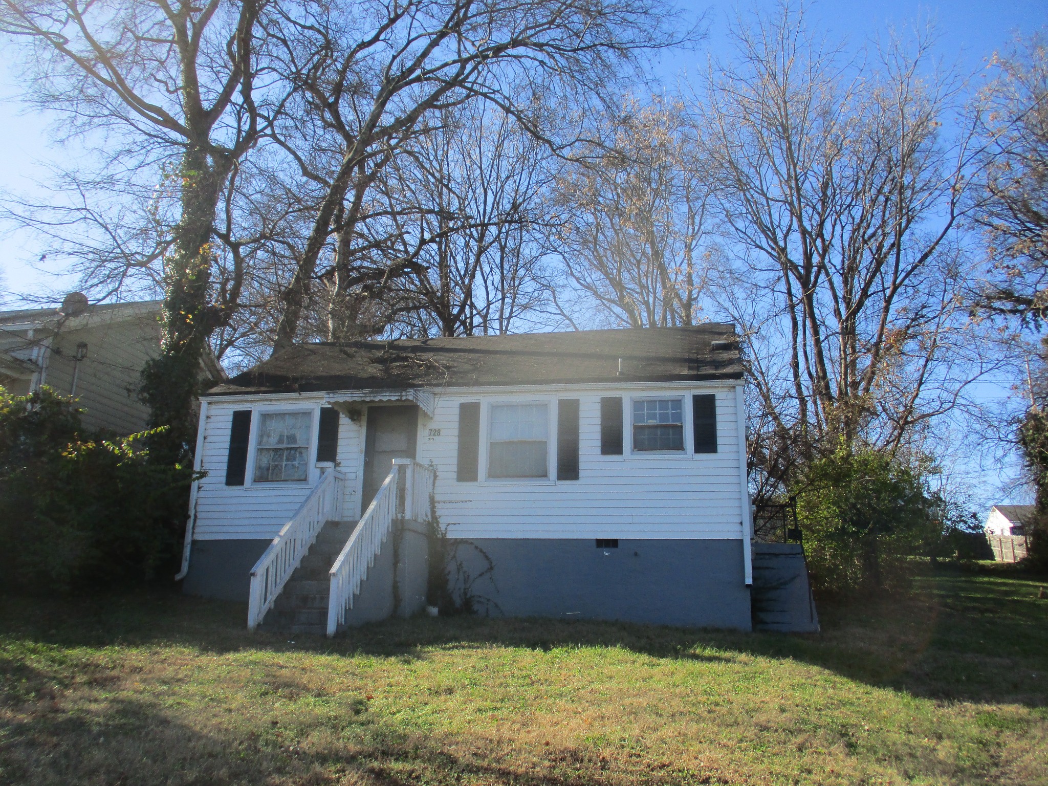 front view of a house with a yard