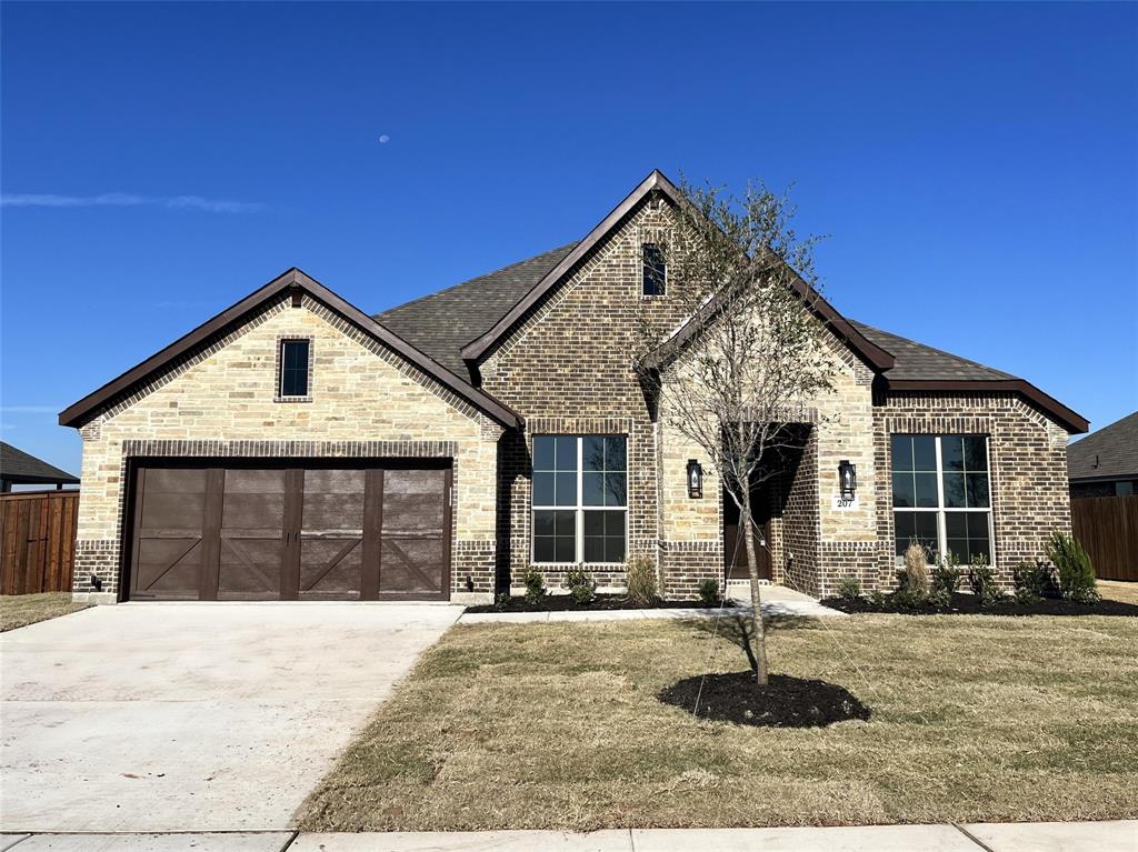 a front view of a house with yard