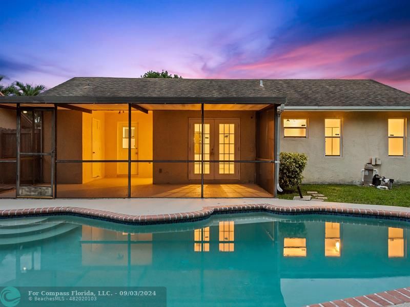 a view of swimming pool with a yard