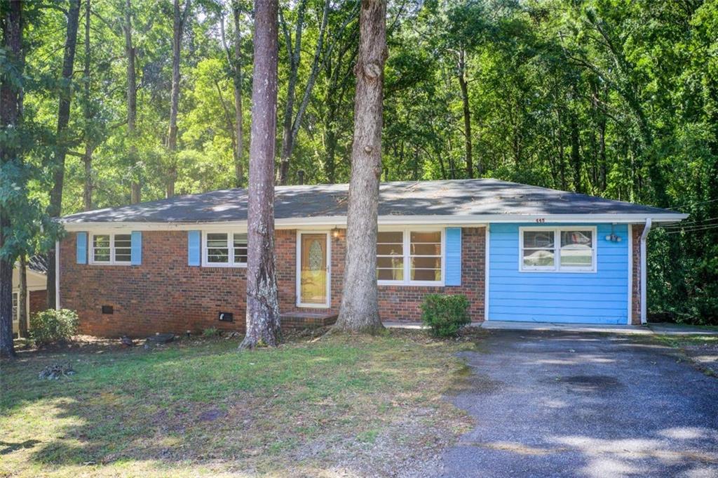 front view of a house with a yard