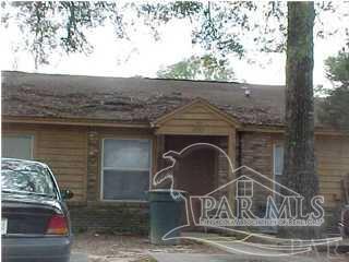 a front view of a house with chairs