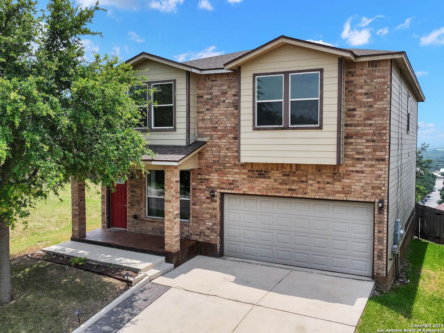 a front view of a house with garage